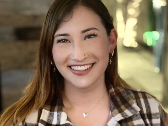 Person with flannel smiling